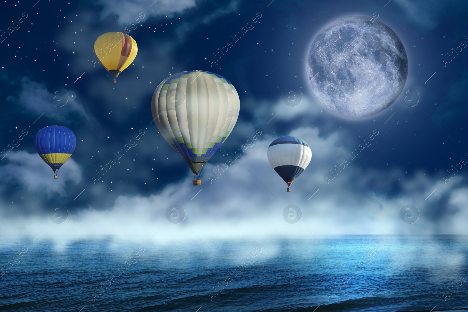 Image of Dream world. Hot air balloons in night sky with full moon over misty sea