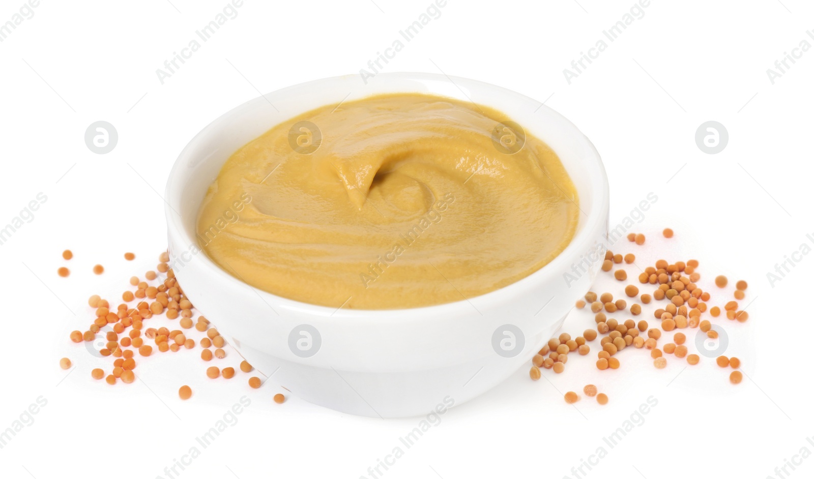 Photo of Fresh tasty mustard sauce in bowl and dry seeds isolated on white