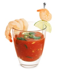 Photo of Tasty shrimp cocktail with sauce in glass and lime isolated on white