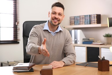 Man using video chat in office, view from web camera