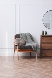 Photo of Modern living room with parquet flooring and stylish furniture