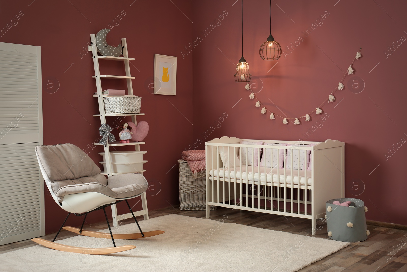 Photo of Cozy baby room interior with crib and rocking chair