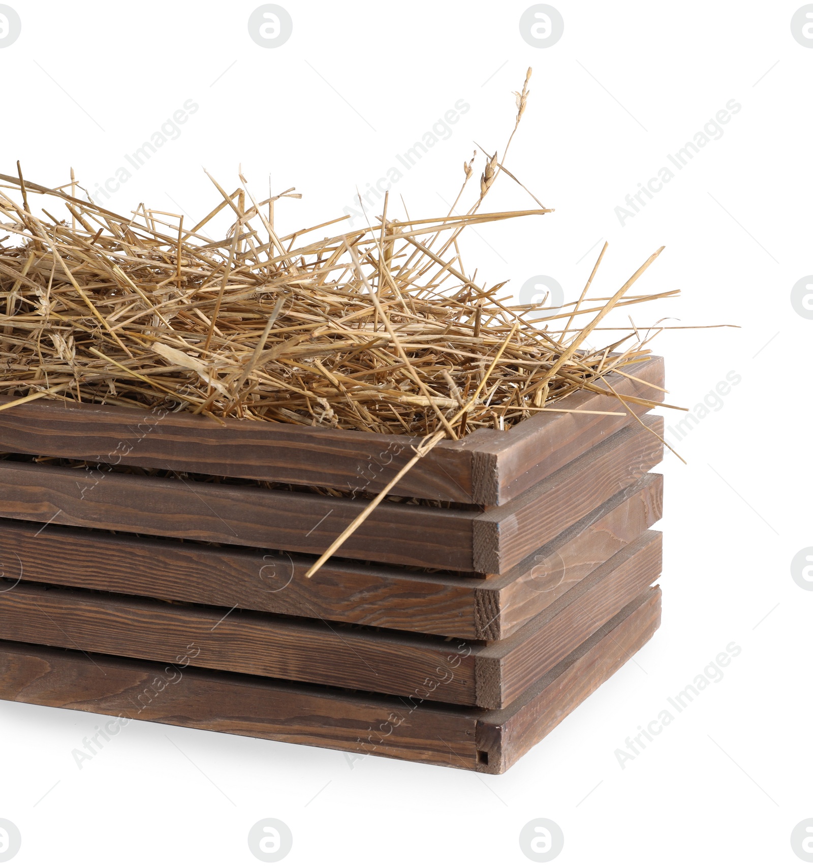 Photo of Dried straw in wooden crate isolated on white
