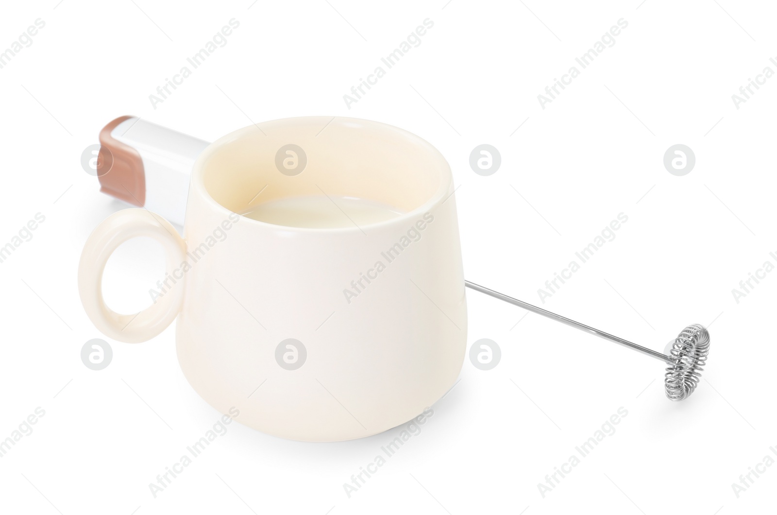 Photo of Milk frother wand and cup isolated on white