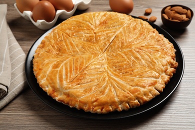Traditional galette des rois on wooden table