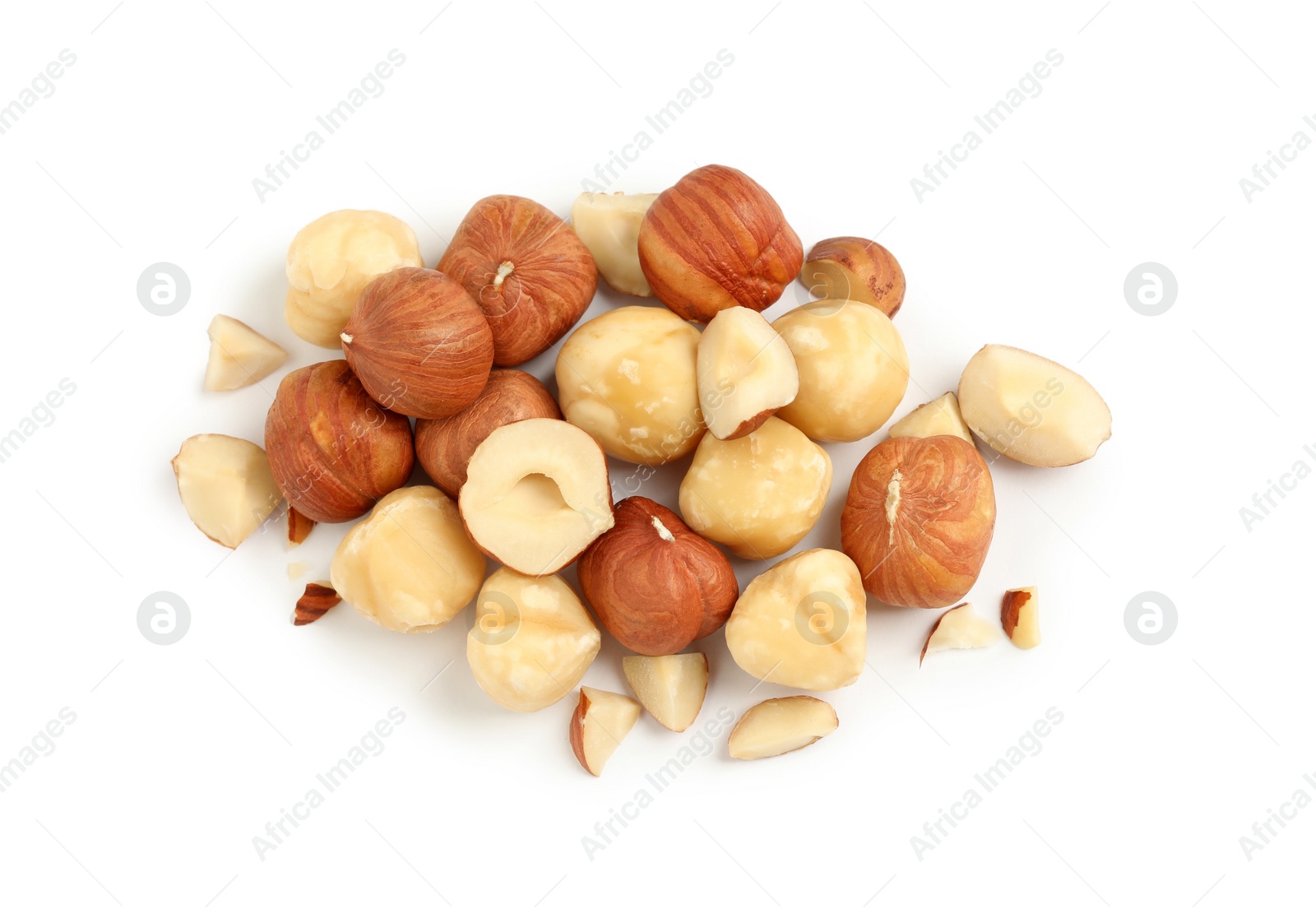 Photo of Heap of tasty hazelnuts on white background, top view