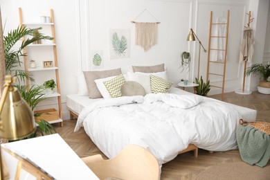 Modern bedroom with beautiful fresh house plants