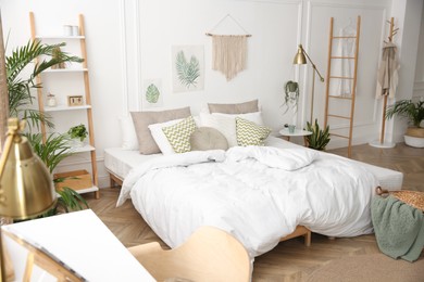 Photo of Modern bedroom with beautiful fresh house plants