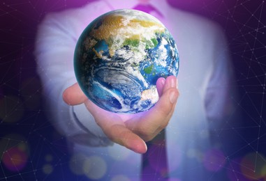 Image of World in our hands. Man holding digital model of Earth, closeup view 
