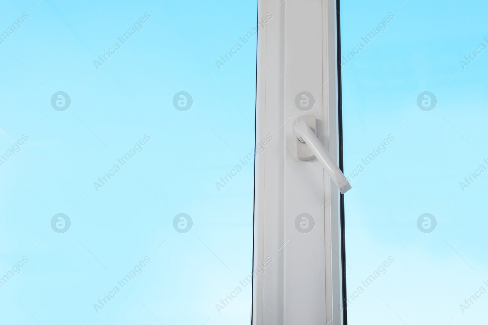 Photo of View of blue sky through modern window indoors