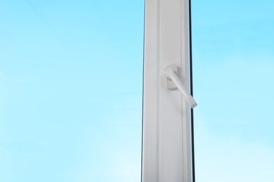 Photo of View of blue sky through modern window indoors