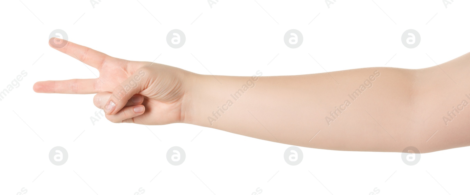 Photo of Playing rock, paper and scissors. Woman making scissors with her fingers on white background, closeup