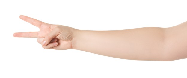 Playing rock, paper and scissors. Woman making scissors with her fingers on white background, closeup