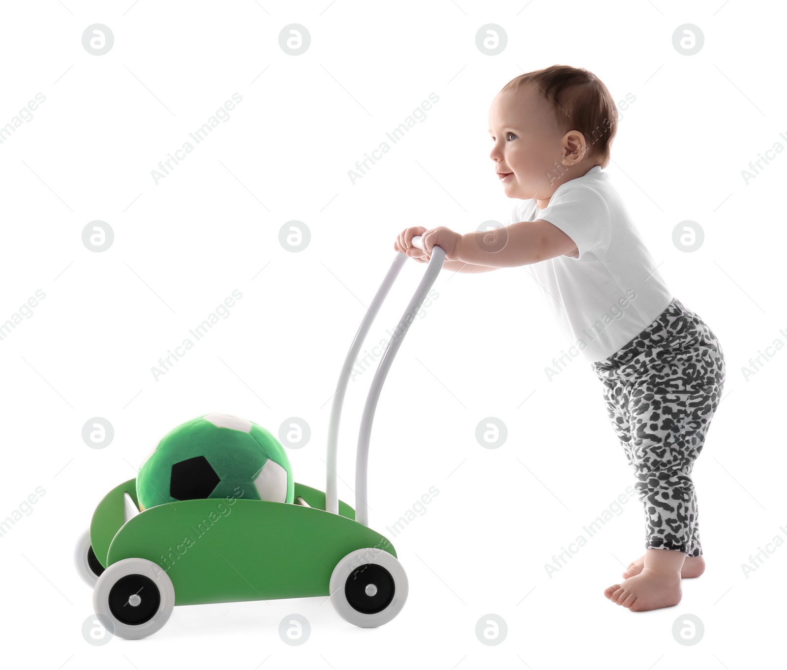 Photo of Cute baby with toy walker on white background