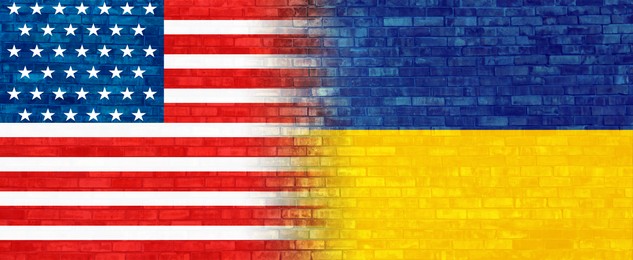 Flags of Ukraine and Usa on brick wall, banner design. International diplomatic relationships