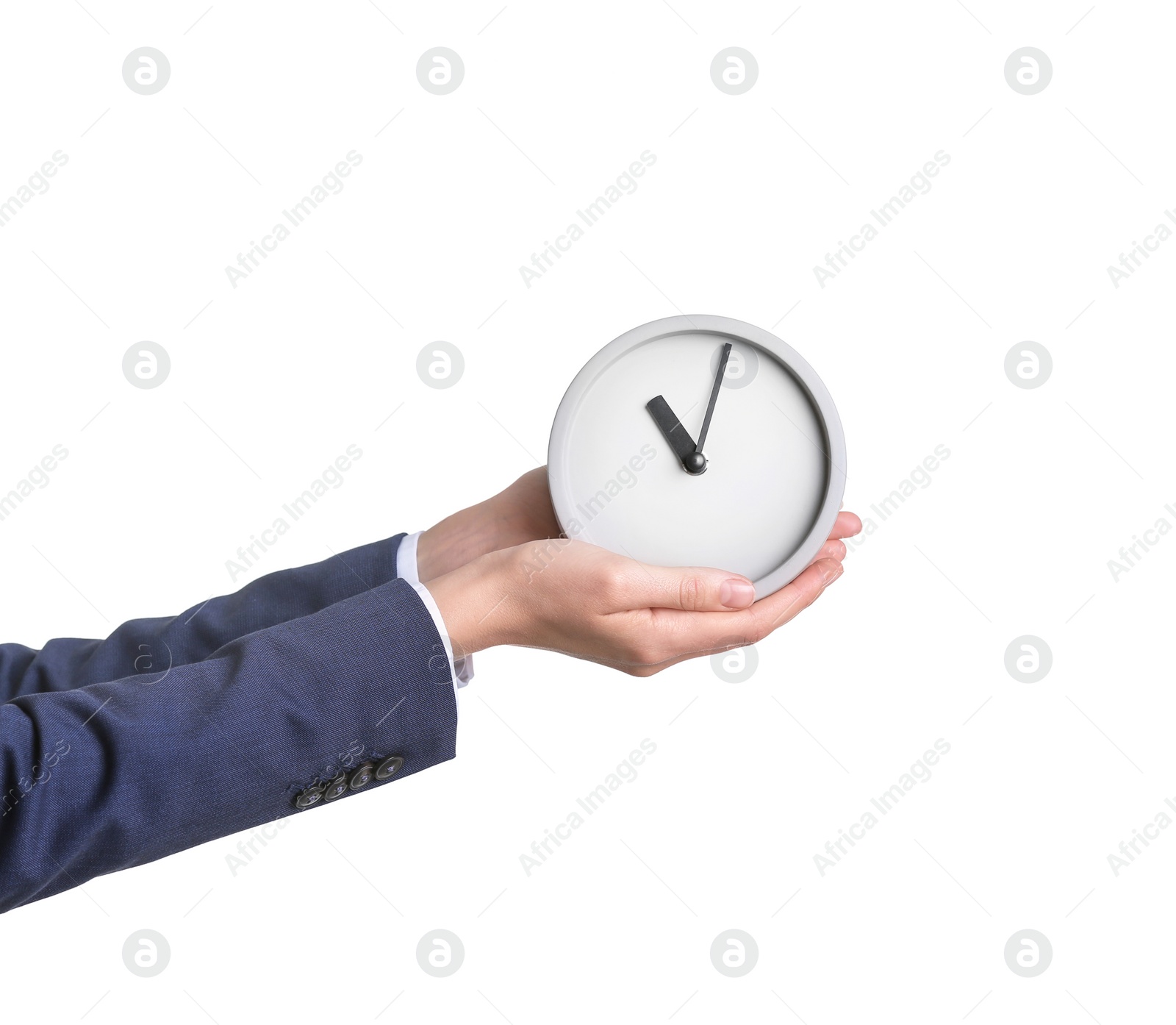 Photo of Businesswoman holding alarm clock on white background. Time concept
