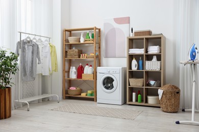 Laundry room interior with washing machine and furniture