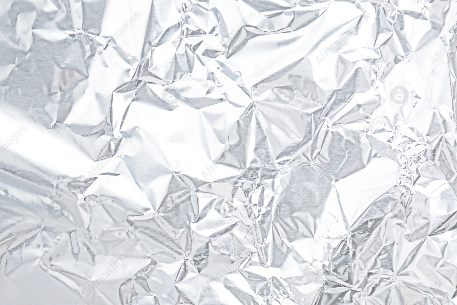 Image of Crumpled white silver foil as background, closeup view