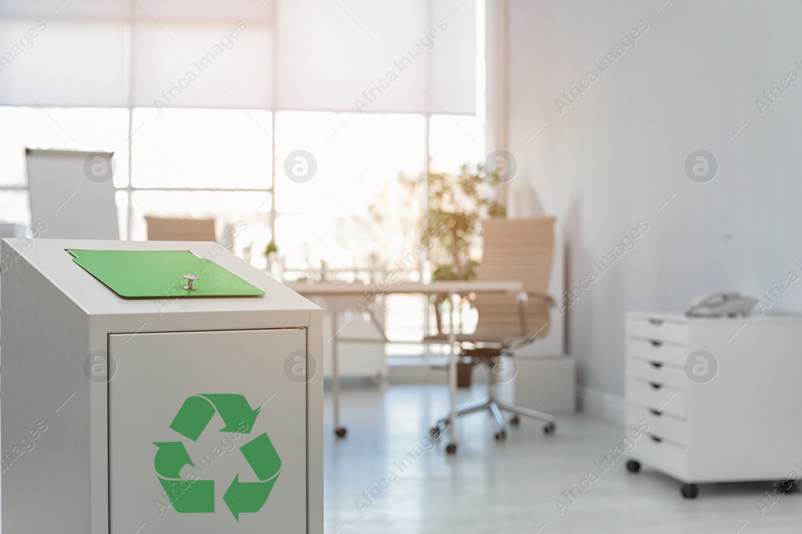 Photo of Trash bin in modern office, space for text. Waste recycling