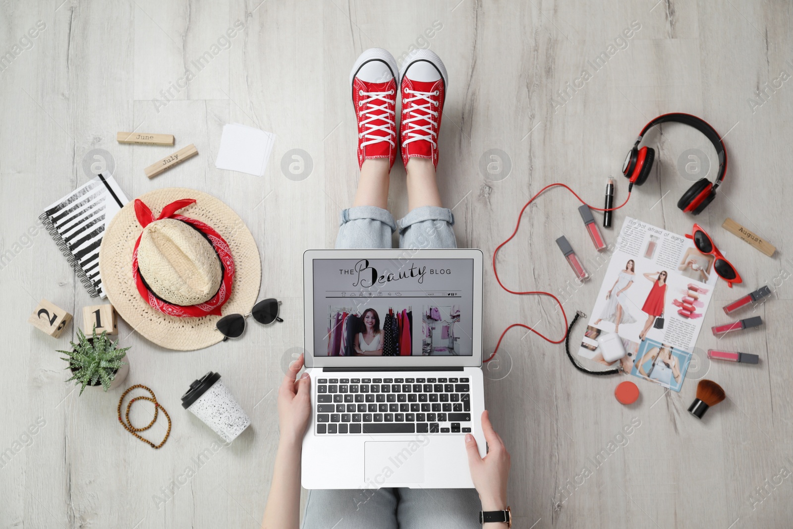 Photo of Beauty blogger with laptop on floor, top view