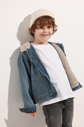 Photo of Fashion concept. Stylish boy posing on white background