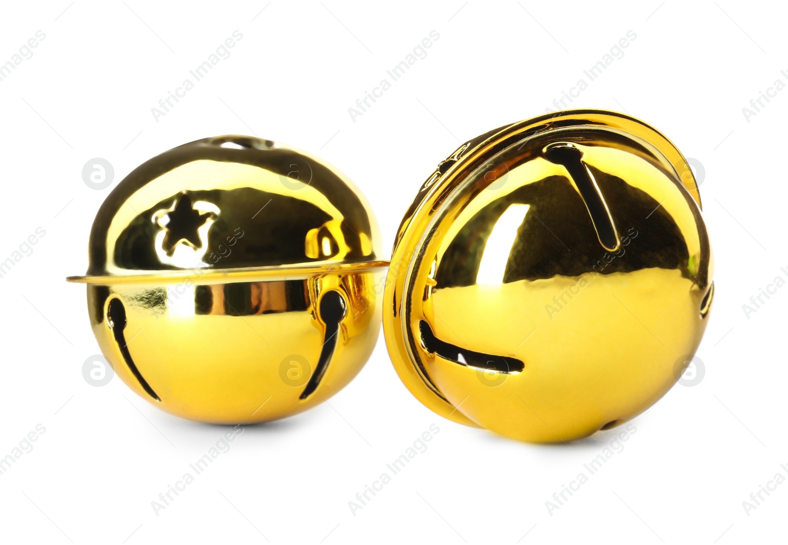 Photo of Shiny golden sleigh bells on white background