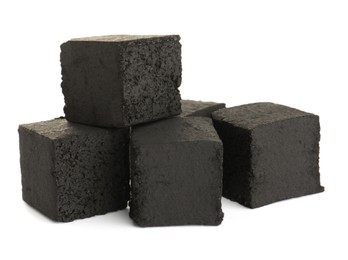 Stack of charcoal cubes for hookah on white background