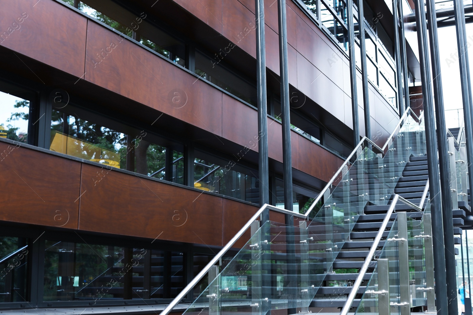 Photo of Wall of beautiful modern building with windows and stairs