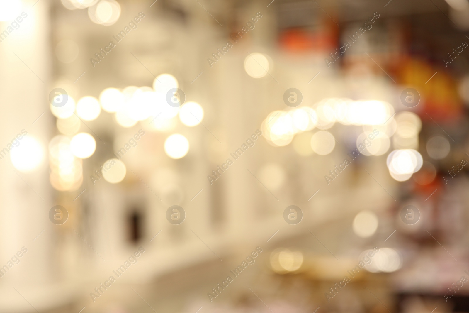 Photo of Blurred view of modern shopping mall interior