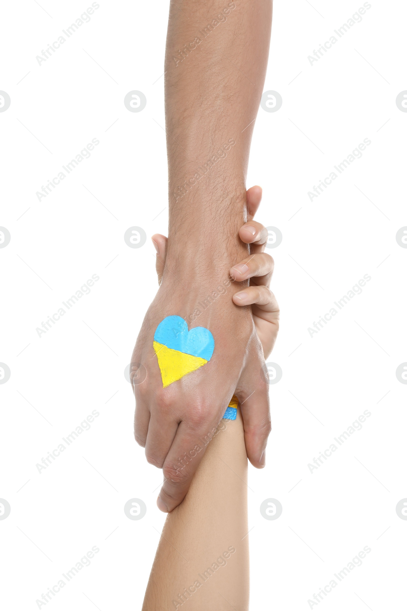 Photo of Woman and man with painted heart in colors of Ukrainian flag on his hand against white background, closeup