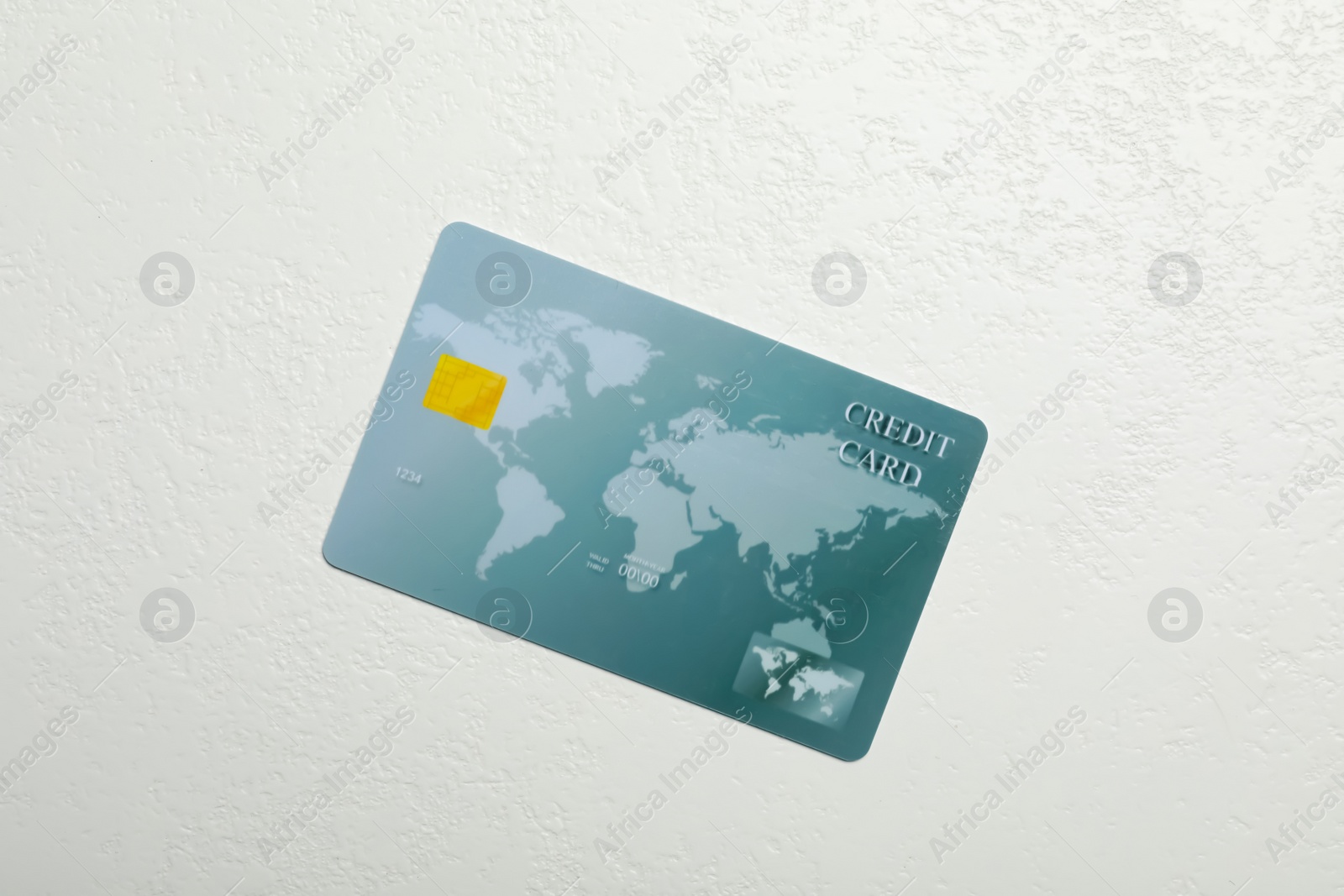 Photo of Credit card on white table, top view