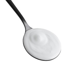 Photo of One black spoon with sour cream isolated on white