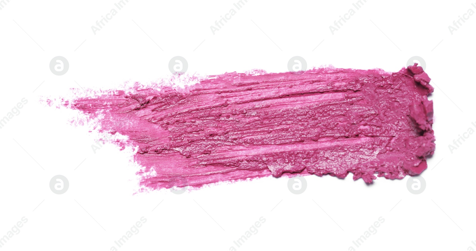 Photo of Smear of bright lipstick on white background, top view