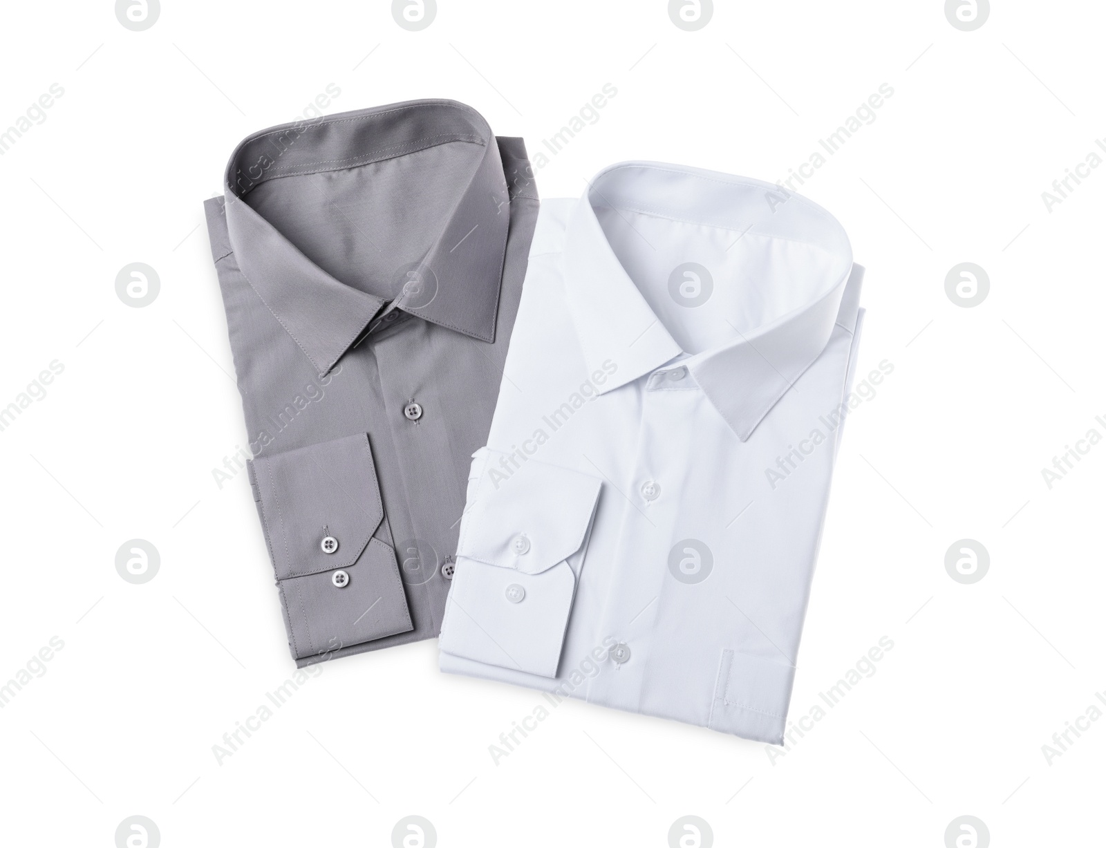 Photo of Stylish shirts isolated on white, top view. Dry-cleaning service