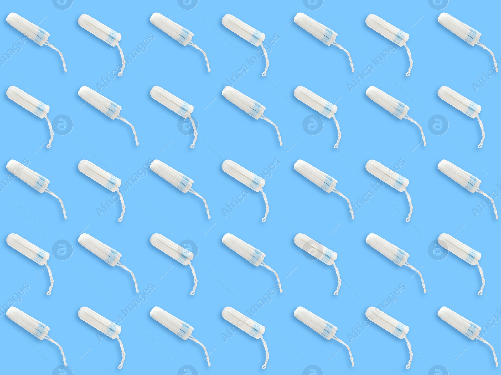 Image of Many tampons on light blue background, flat lay 