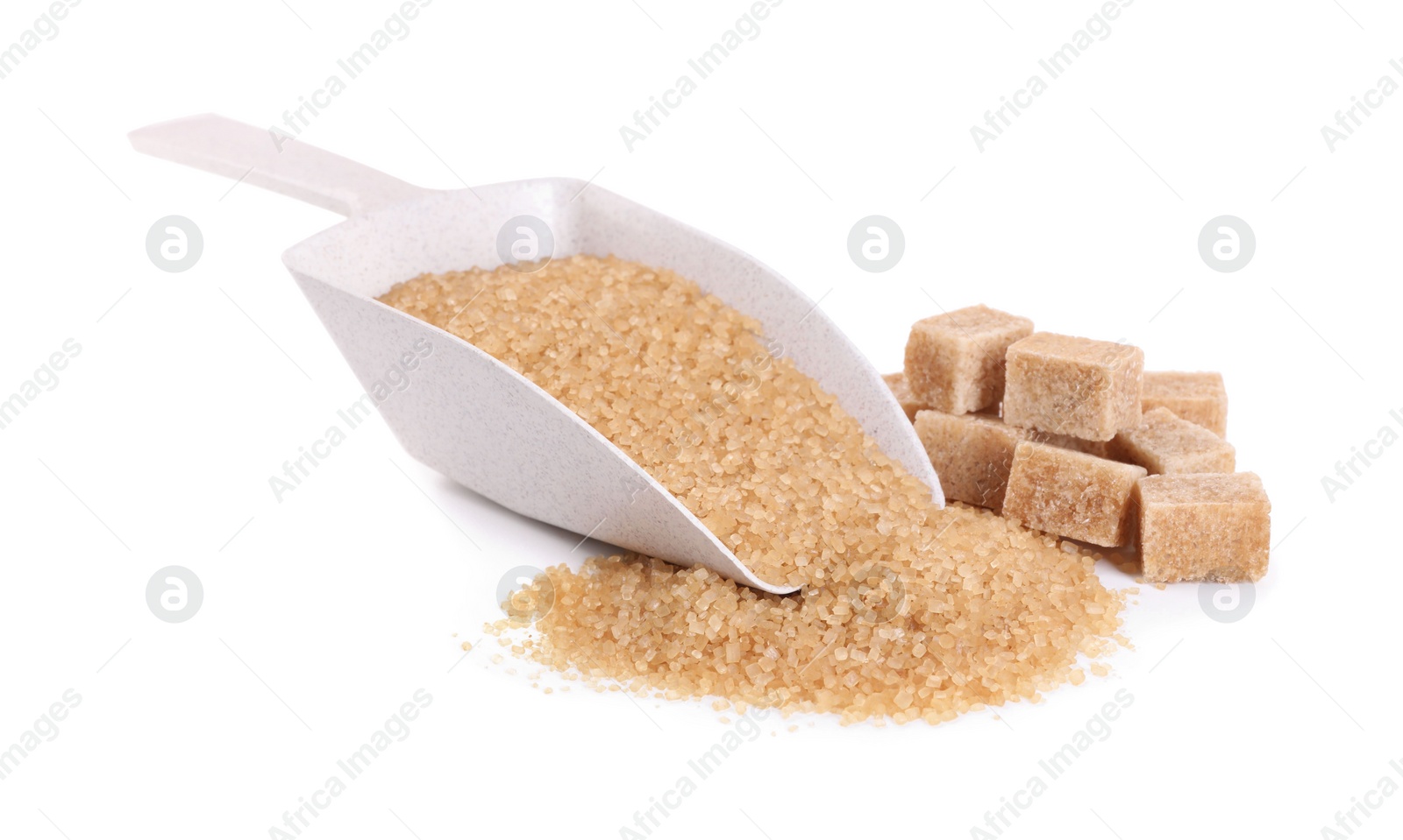 Photo of Different types of brown sugar and scoop isolated on white