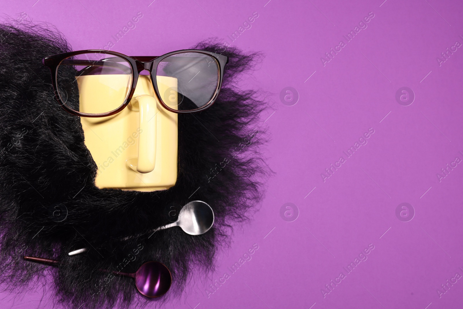 Photo of Man's face made of artificial beard, cup and glasses on purple background, top view. Space for text