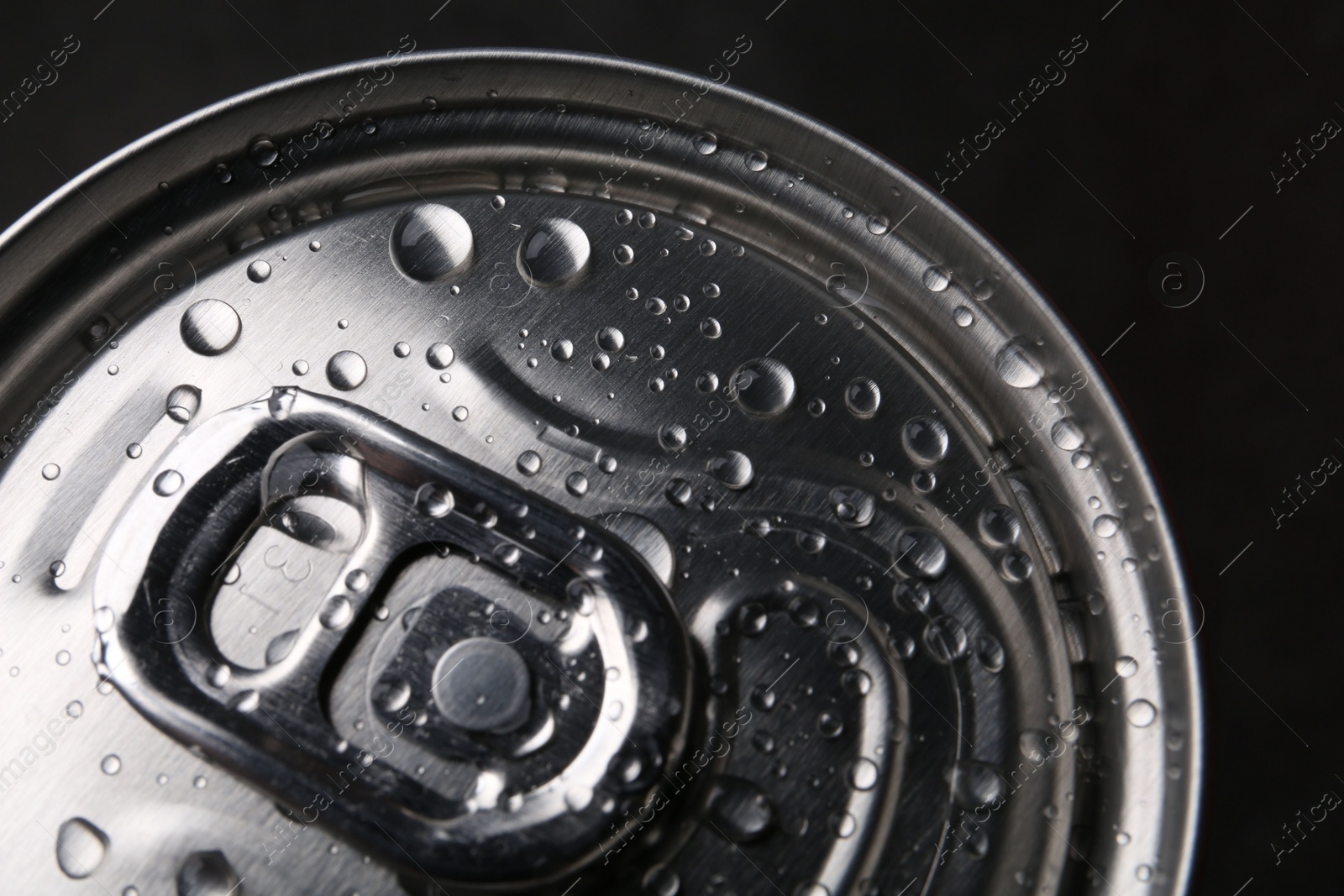 Photo of Energy drink in wet can, closeup. Functional beverage