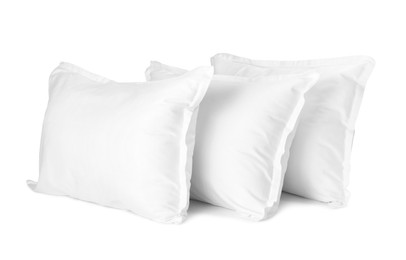 Photo of Many new soft pillows isolated on white