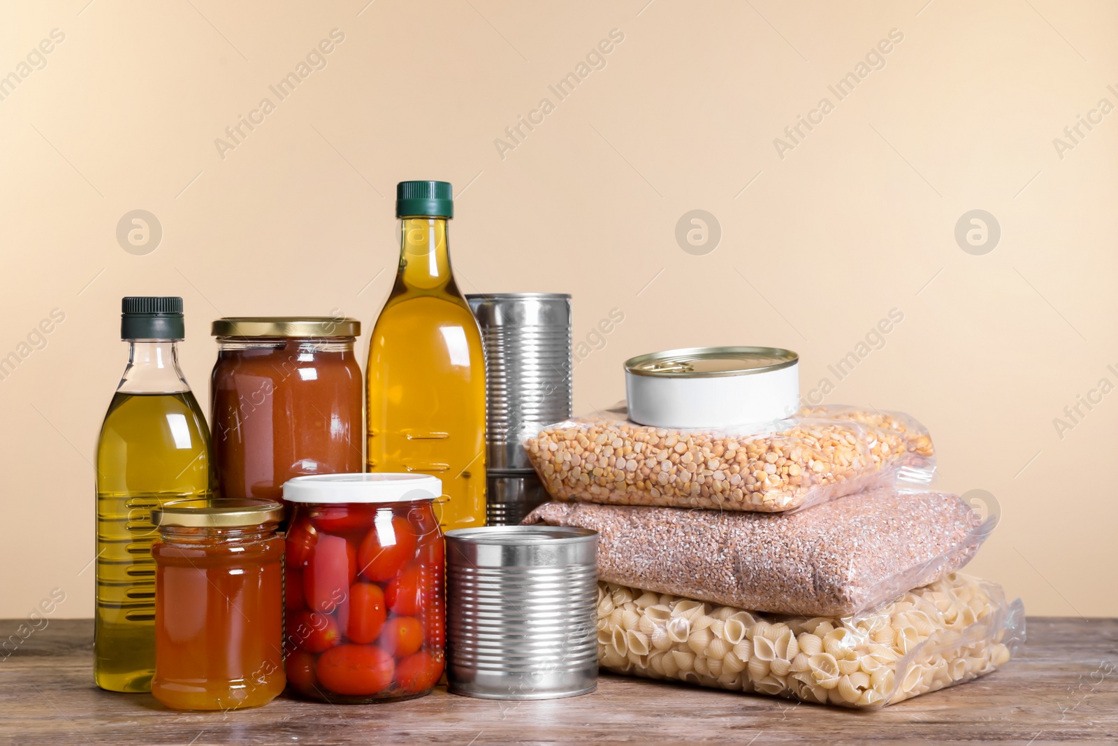 Photo of Different products on wooden table. Food donation