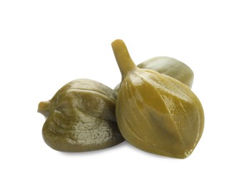 Photo of Three delicious pickled capers on white background