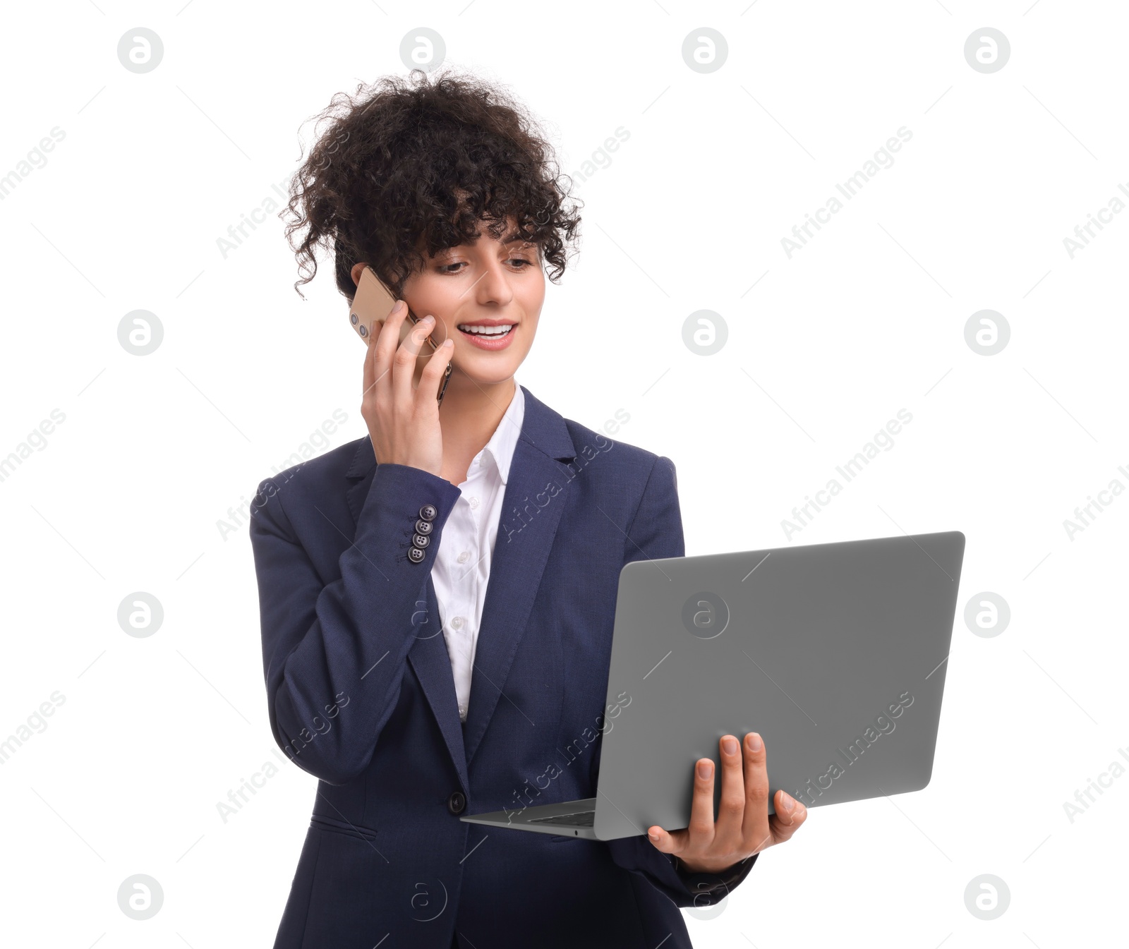 Photo of Beautiful businesswoman in suit with laptop talking on smartphone against white background