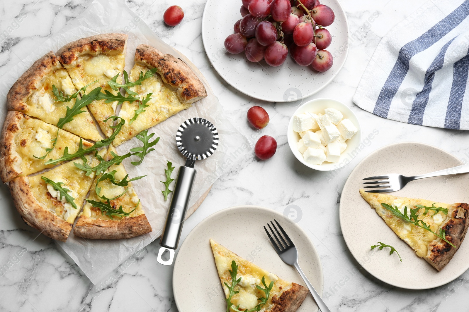 Photo of Tasty cheese pizza served on white marble table, flat lay