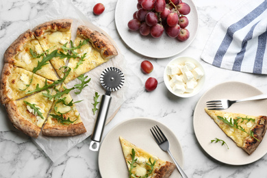 Tasty cheese pizza served on white marble table, flat lay