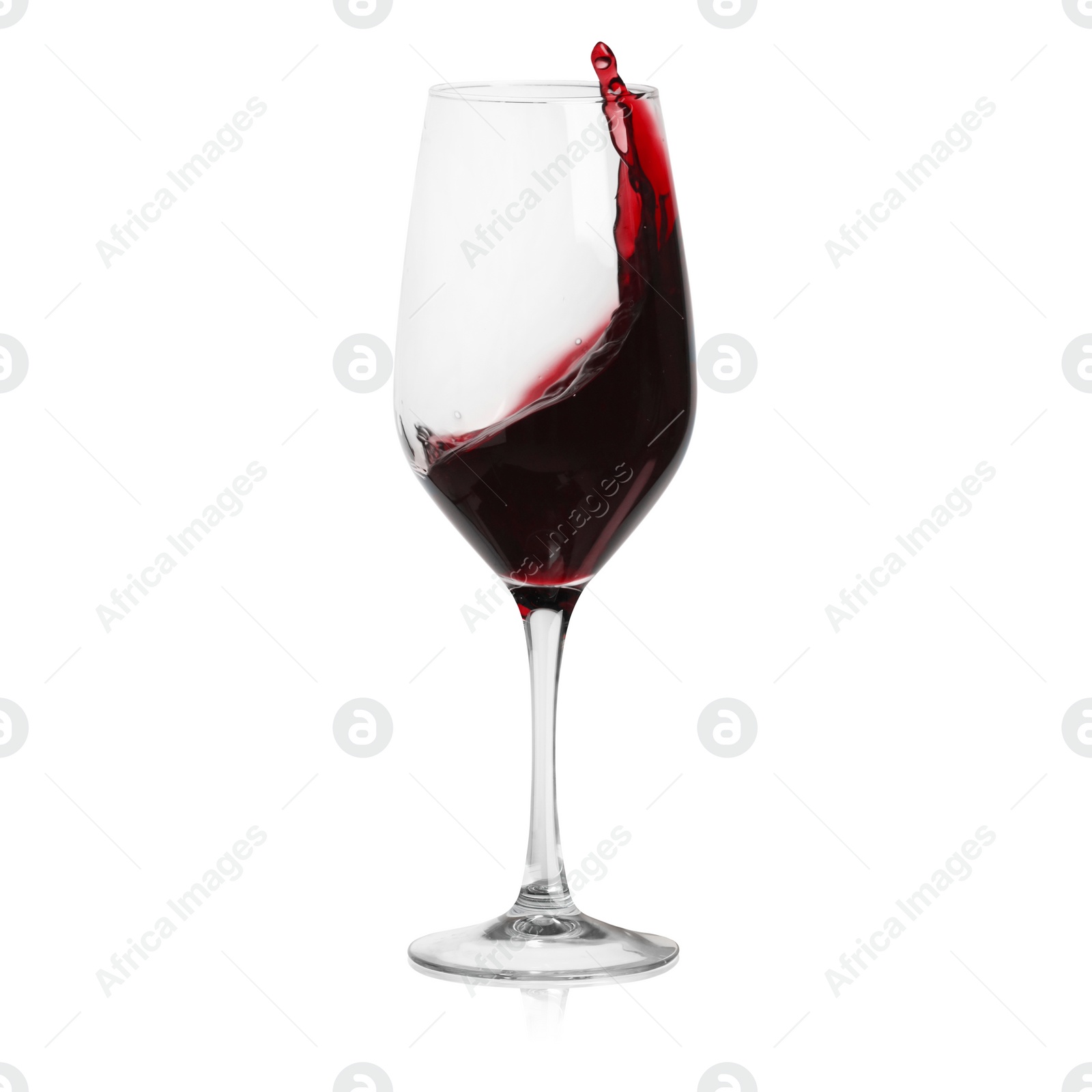 Image of Red wine splashing in glass on white background