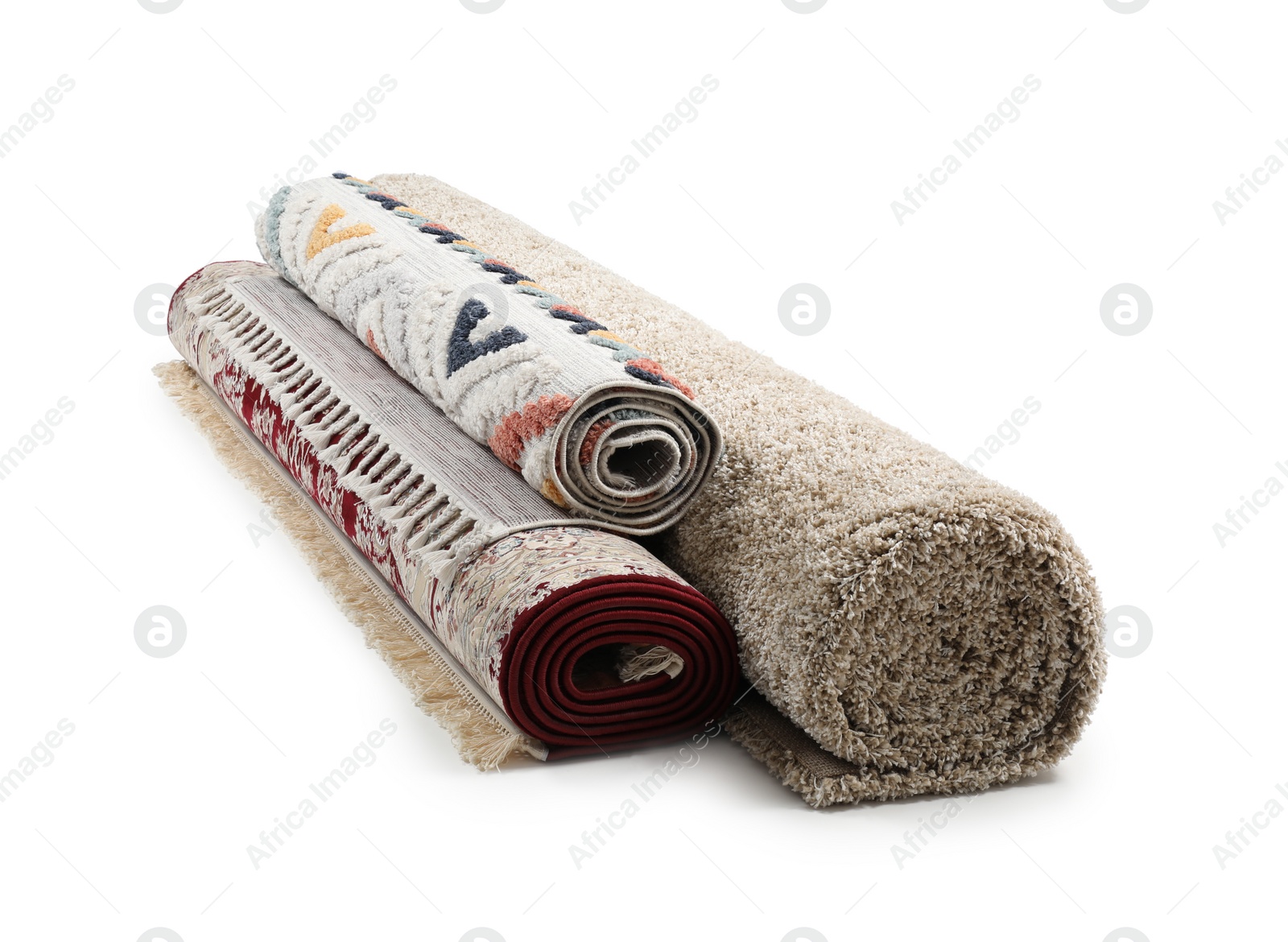 Photo of Rolled carpets on white background. Interior element