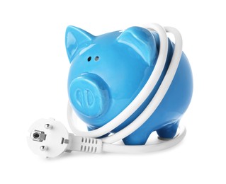 Blue piggy bank and power plug on white background. Energy saving concept