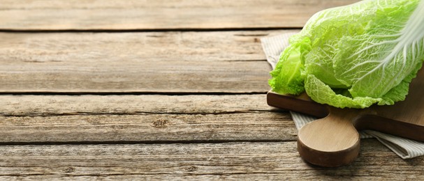 Image of Fresh ripe Chinese cabbage on wooden table, space for text. Banner design