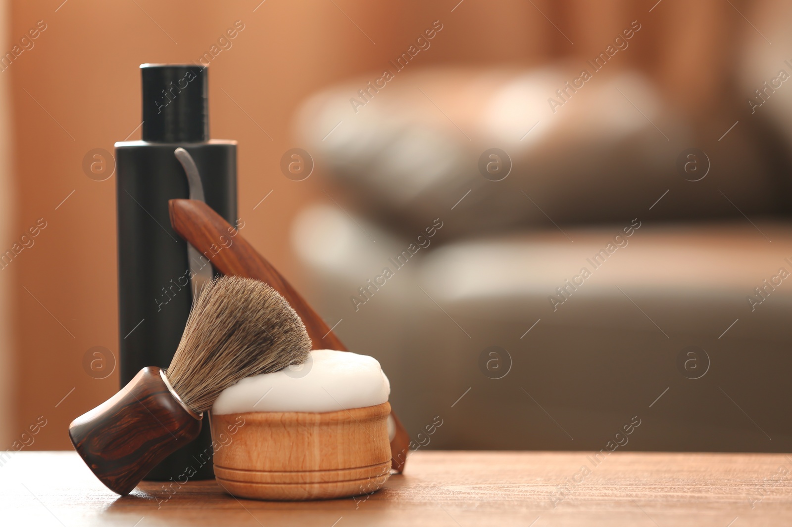 Photo of Shaving accessories on table against blurred background with space for text