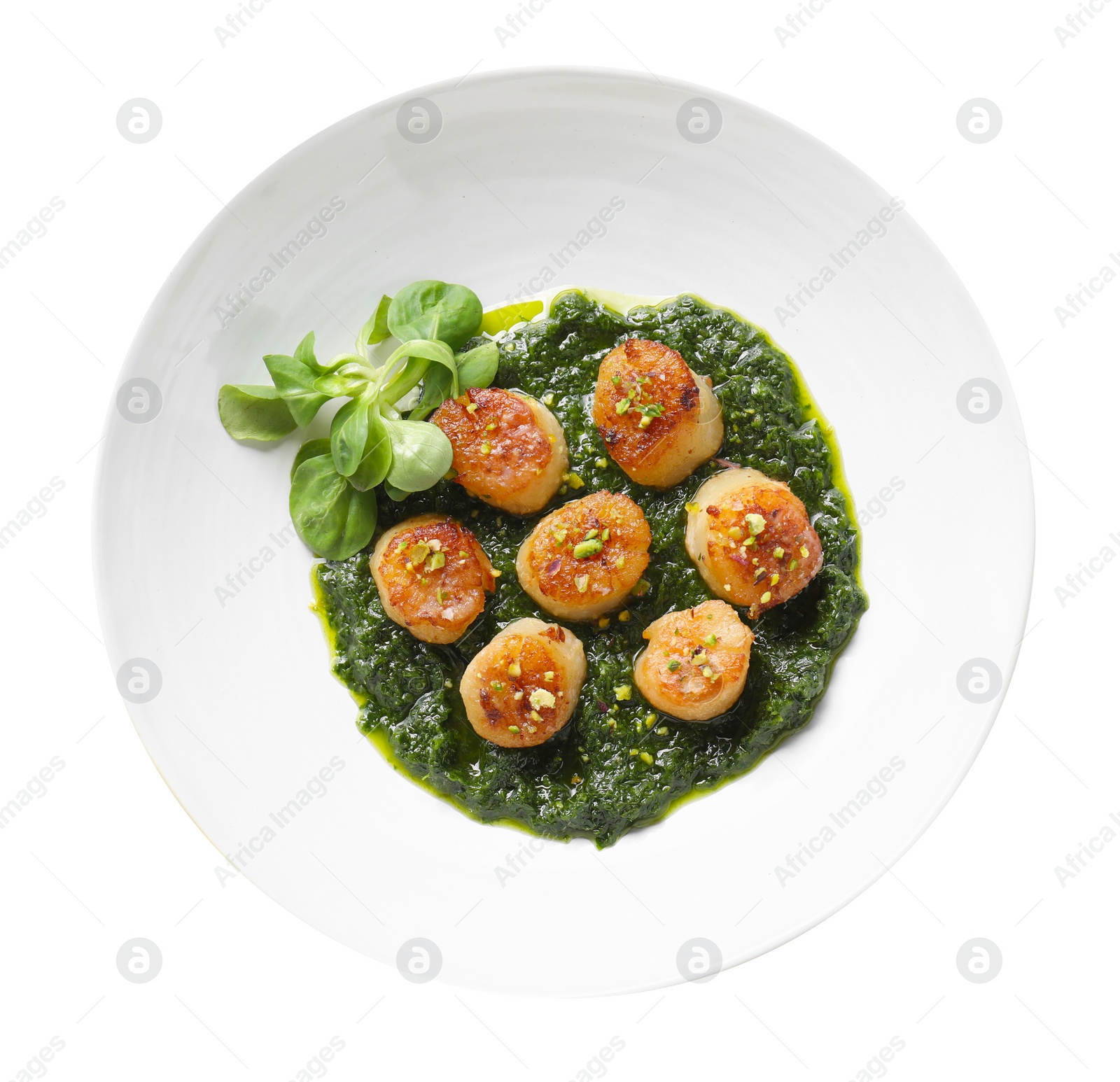 Photo of Delicious fried scallops with tasty sauce and corn salad in bowl isolated on white, top view